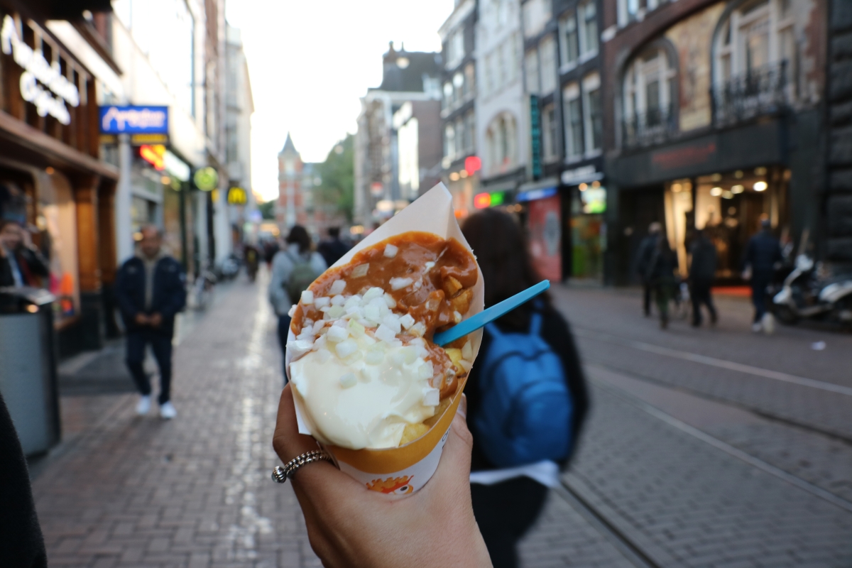 Try the local street food.  Amsterdam is dotted with many french fry stands throughout the city.  Grab a cone to go with one of their many unique sauces.  The local favorite is a peanut sauce with mayonnaise and chopped onions.  Doesn't sound very appealing? Don't worry, they still have ketchup or bar-b-que for all the Americans.                  